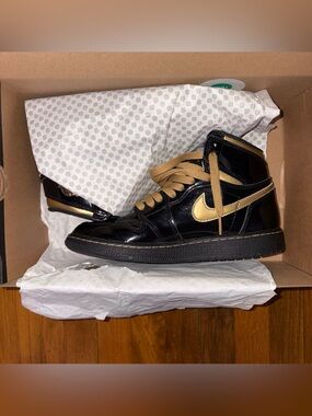 Nike Air Jordan 1 High Black with Metallic Gold Swoosh Limited Edition